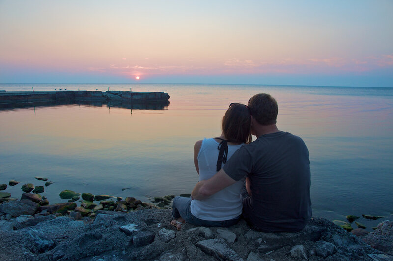 Couple Sitting on Rocks