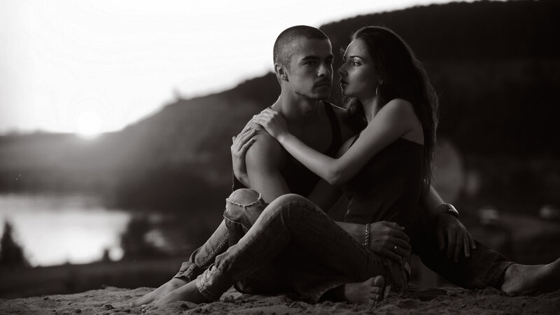 Couple Sitting on Sand