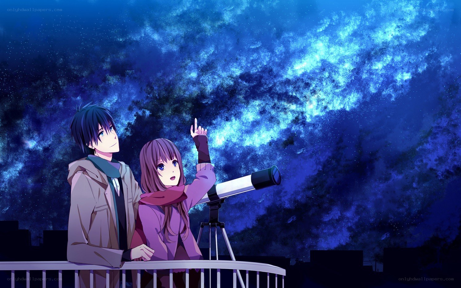 couple stargazing on balcony