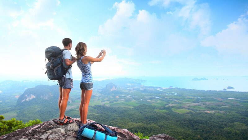 Couple taking photo on mountain