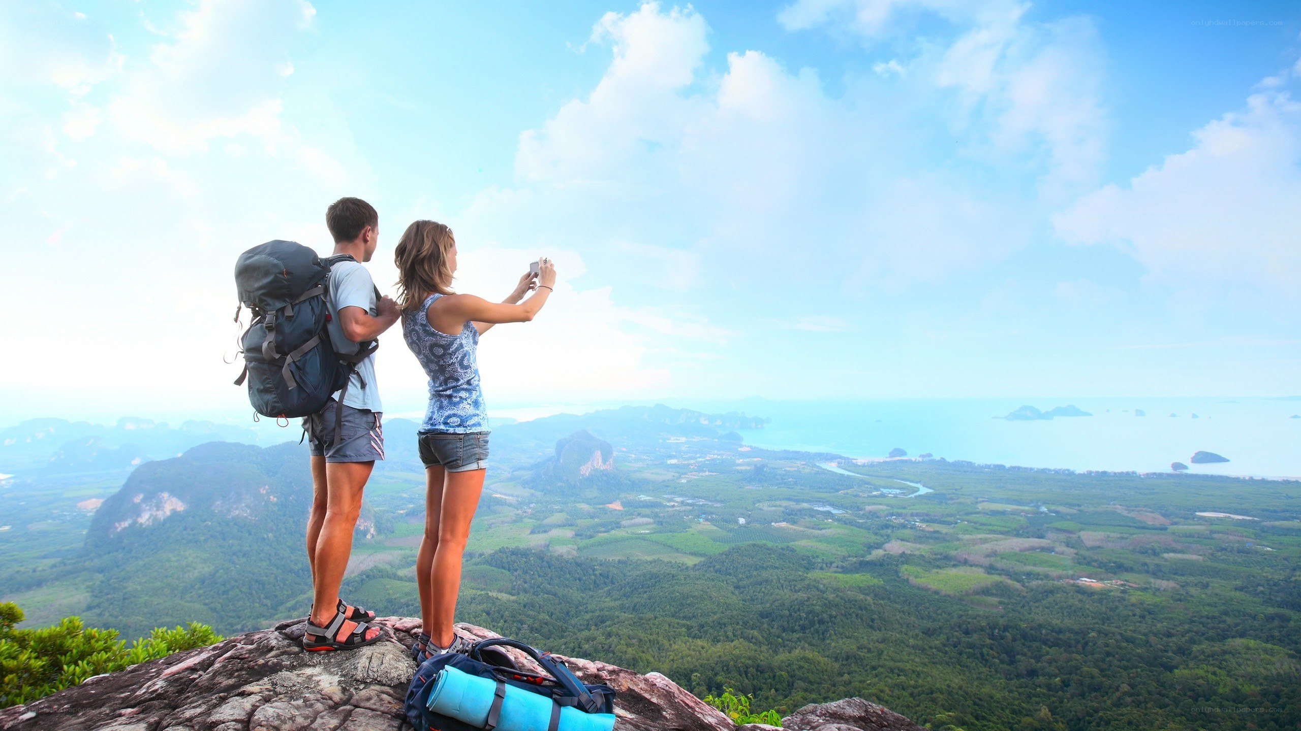 Couple taking photo on mountain