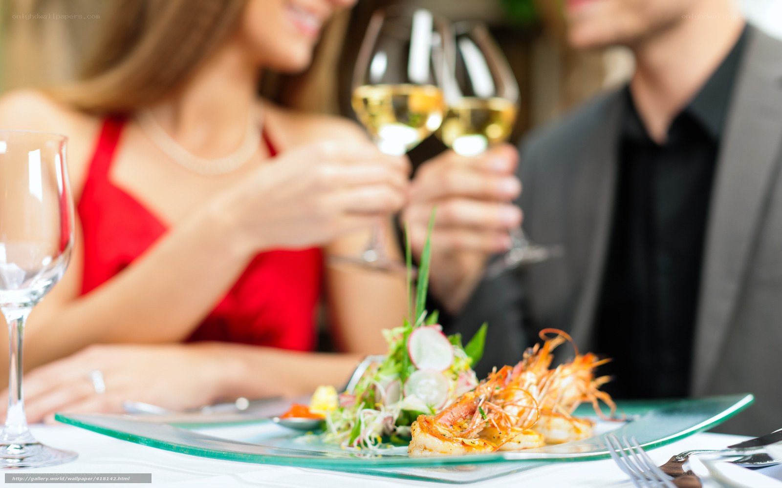 Couple toasting at dinner