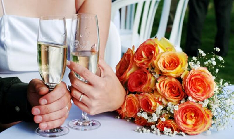 Couple Toasting with Champagne — White