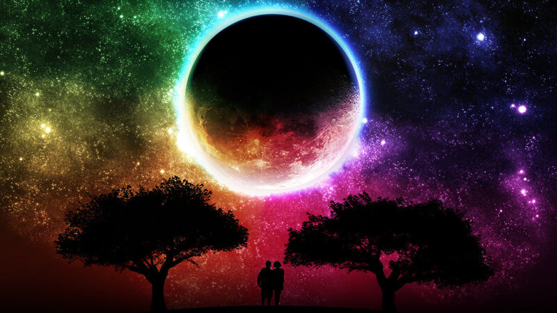 Couple under a rainbow eclipse