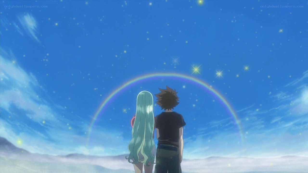 couple under a rainbow sky