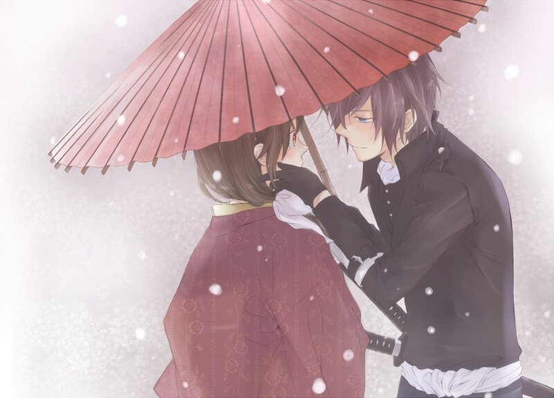 Couple under a red umbrella