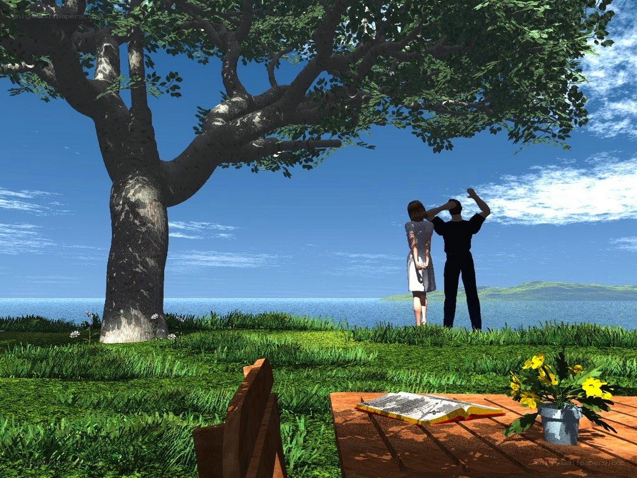 Couple under a tree by the sea