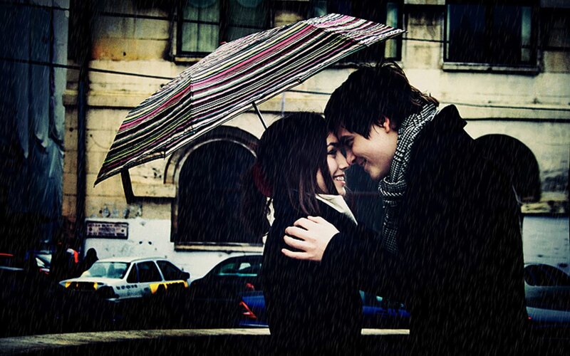 Couple under an umbrella in the rain