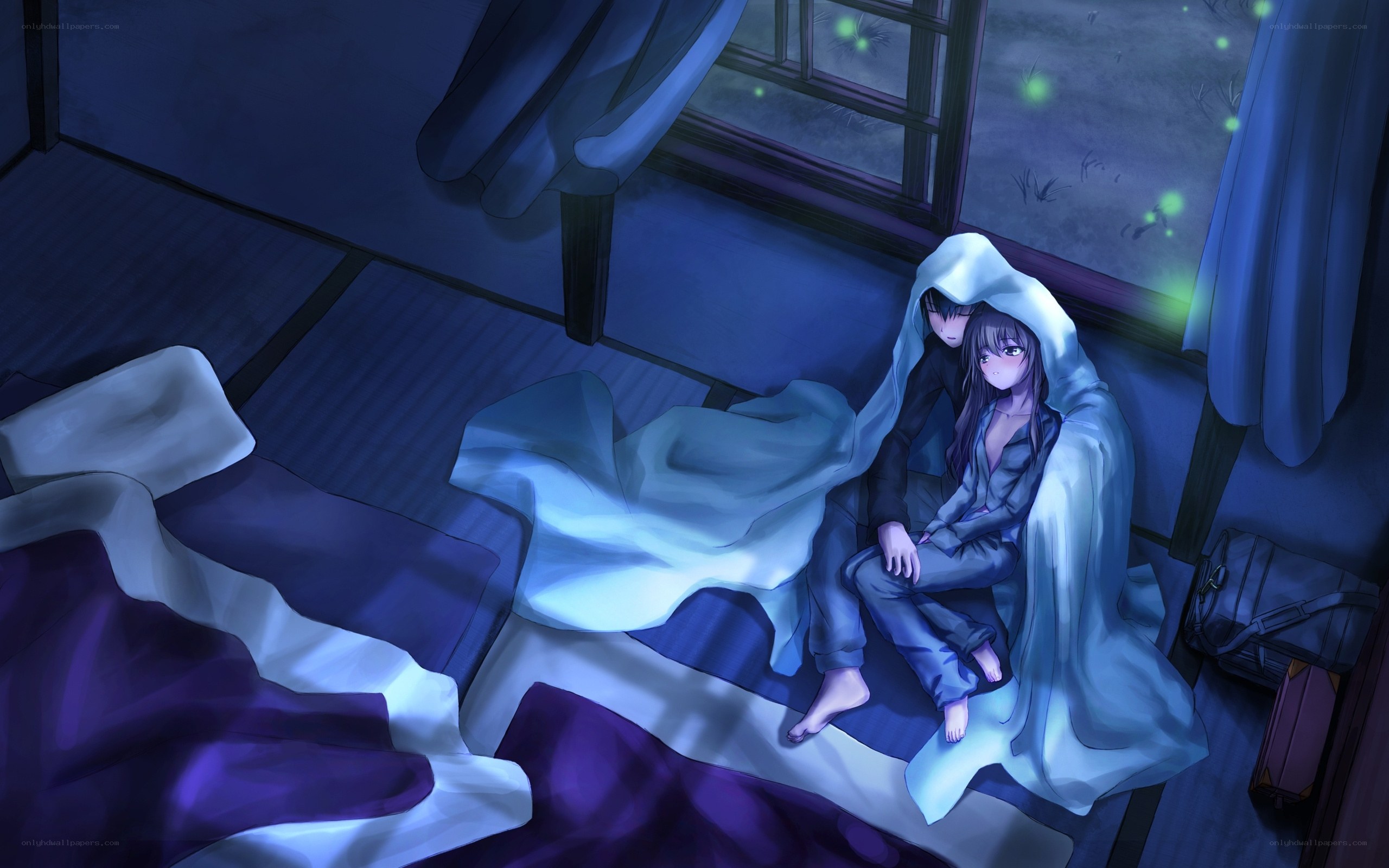 Couple under blanket at night