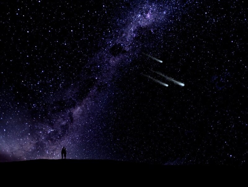 Couple under meteor shower