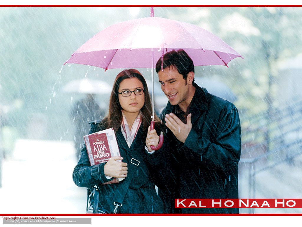 Couple under pink umbrella in rain