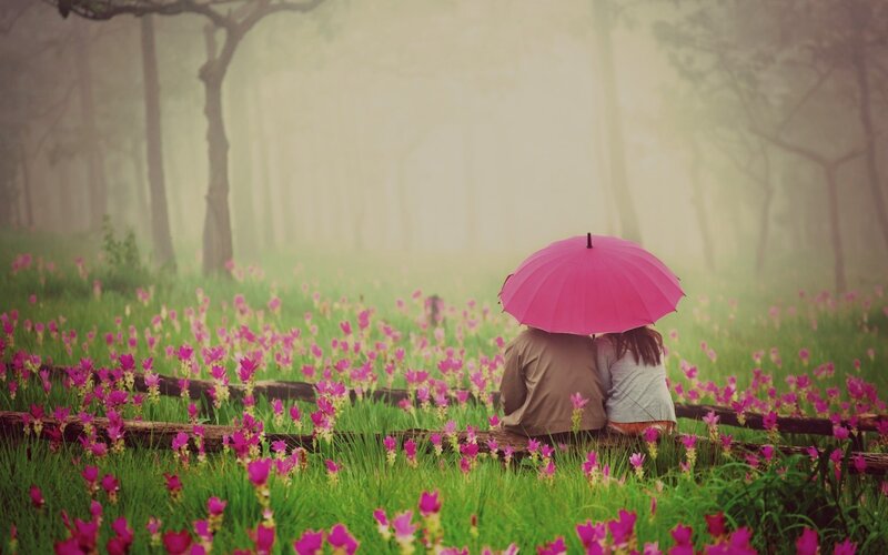 Couple under Pink Umbrella
