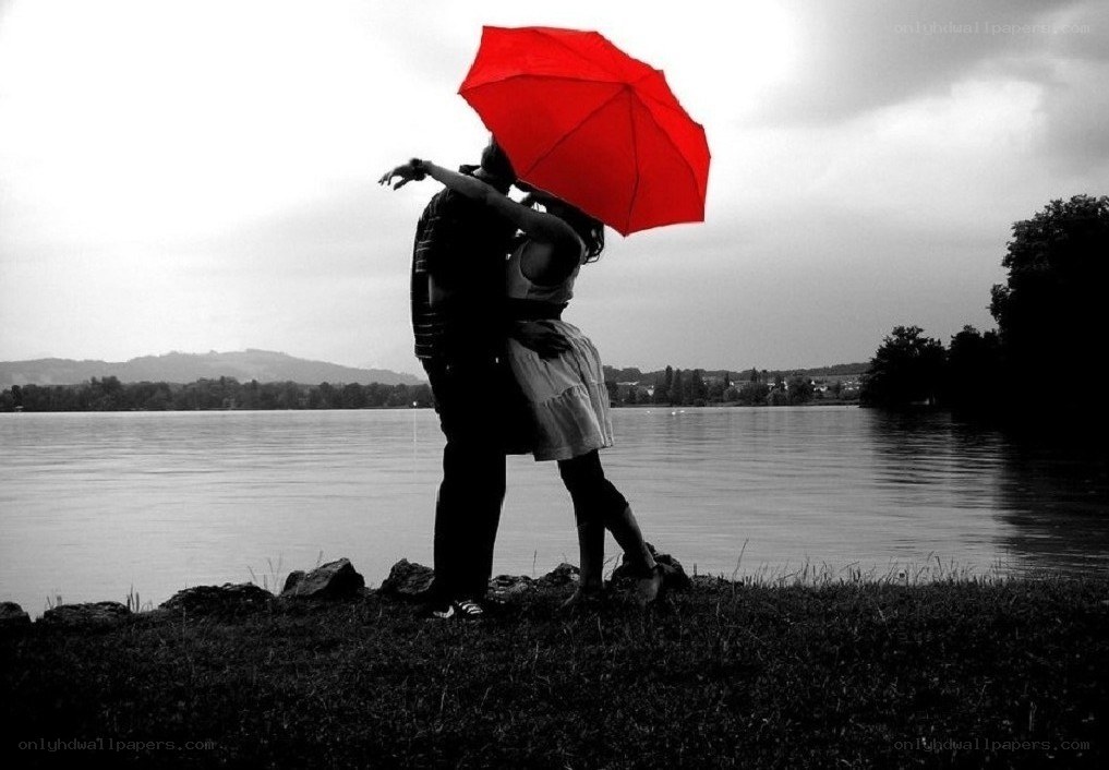 Couple under red umbrella