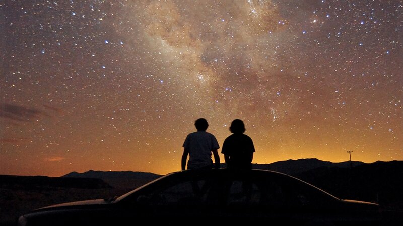 Couple under starry sky