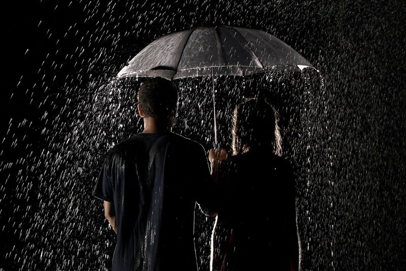couple under umbrella in rain