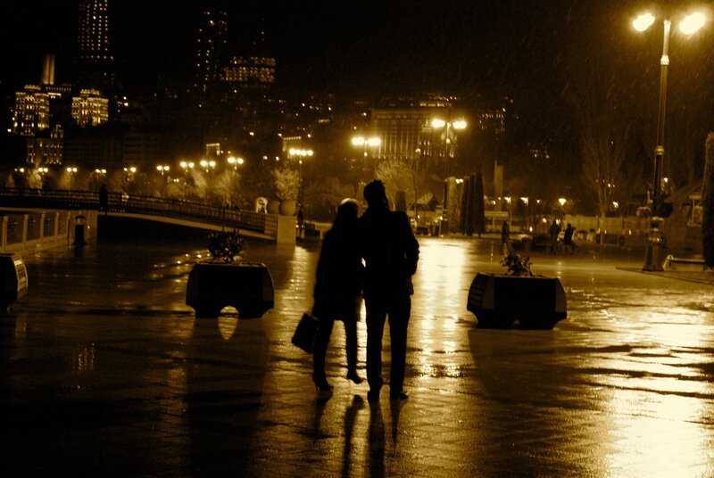 Couple walking at night in the city