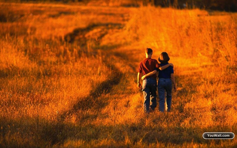 Couple Walking in Field