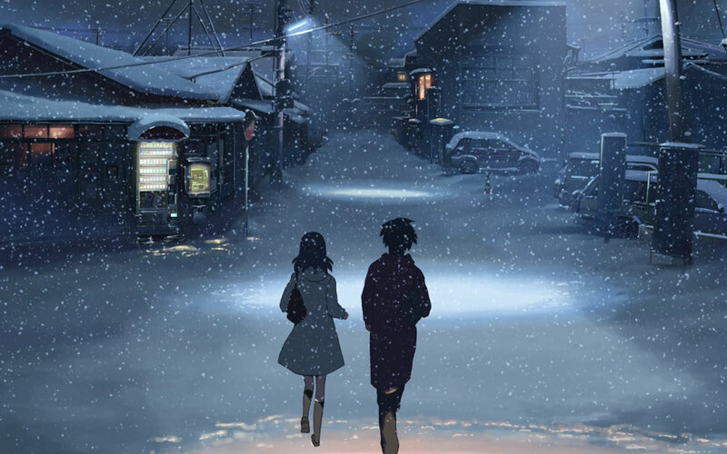 couple walking in snowy night