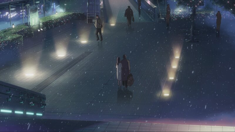 Couple walking in snowy night