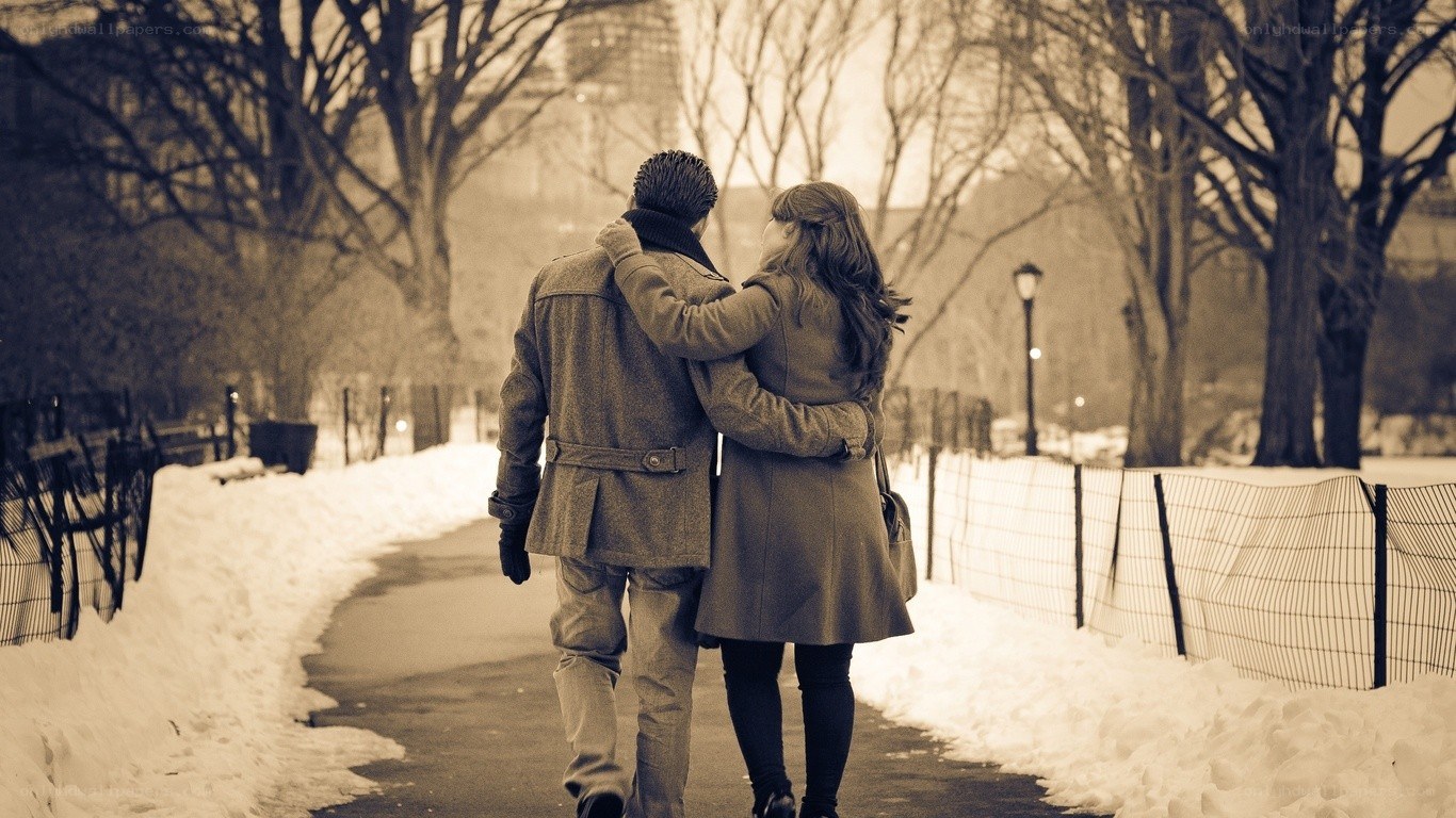 Couple walking in winter park