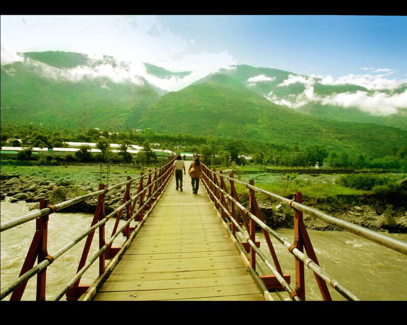 Couple walking on a bridge