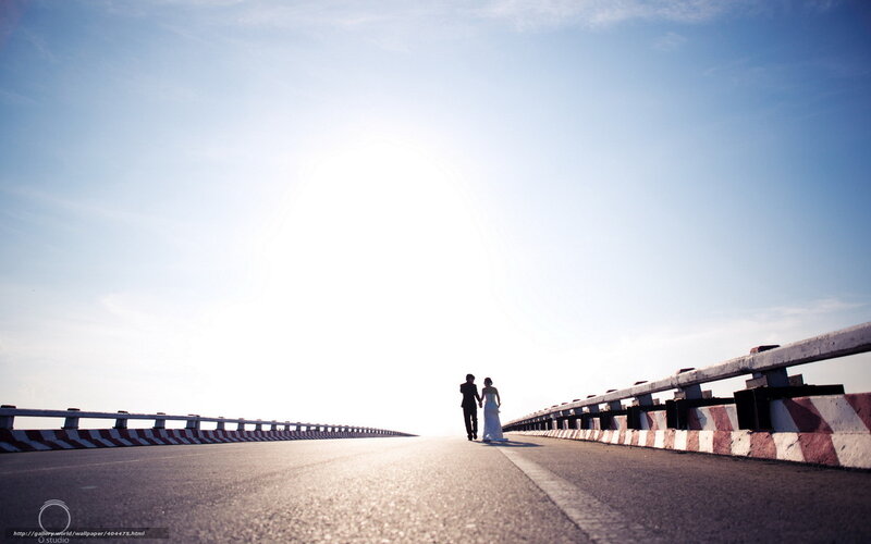 Couple walking on a bridge