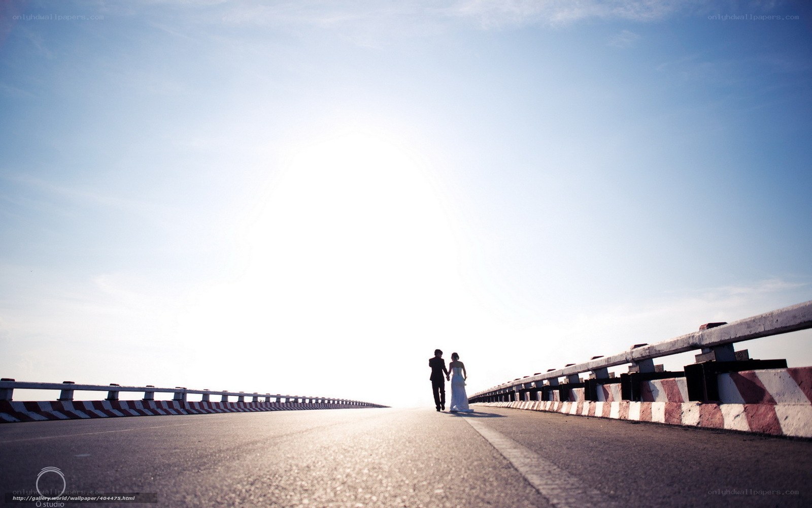 Couple walking on a bridge