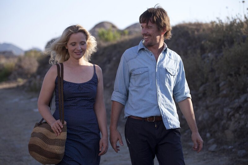 couple walking on a dirt path
