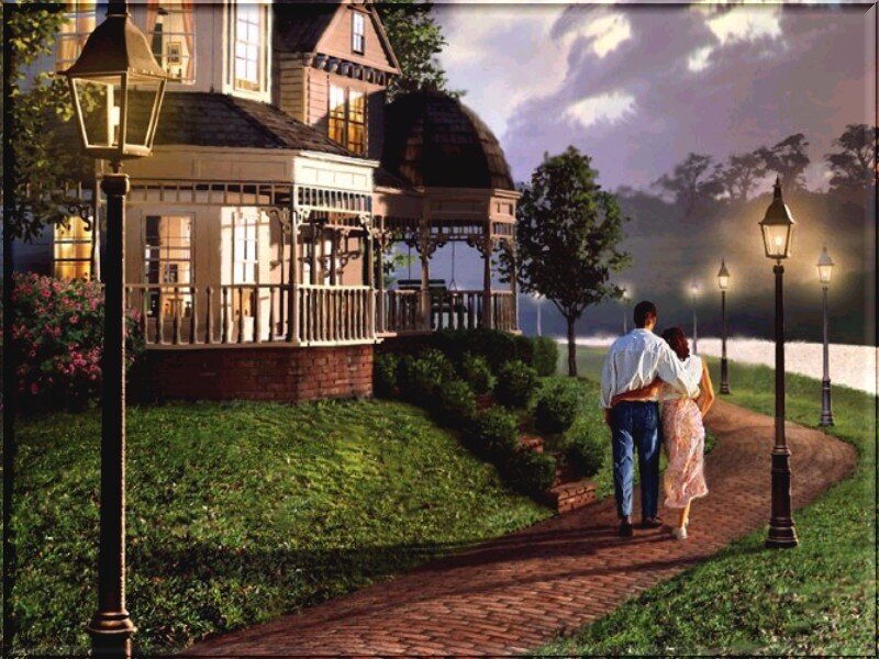 Couple walking on a path at dusk
