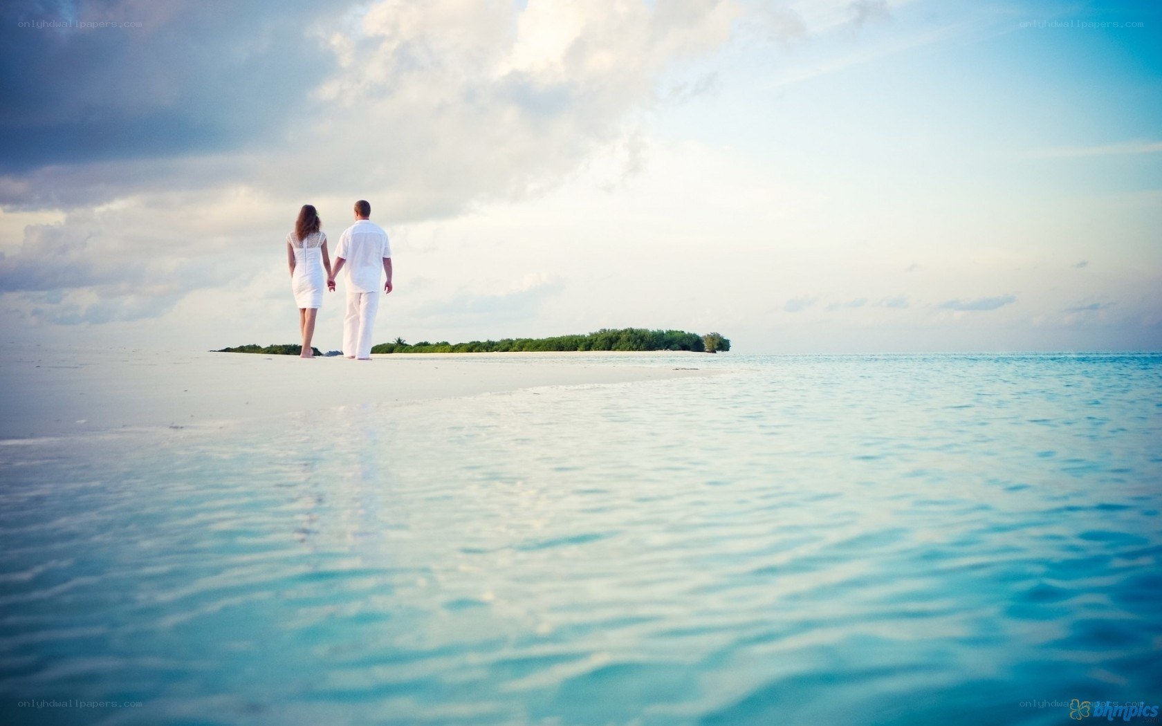 Couple walking on a tropical beach