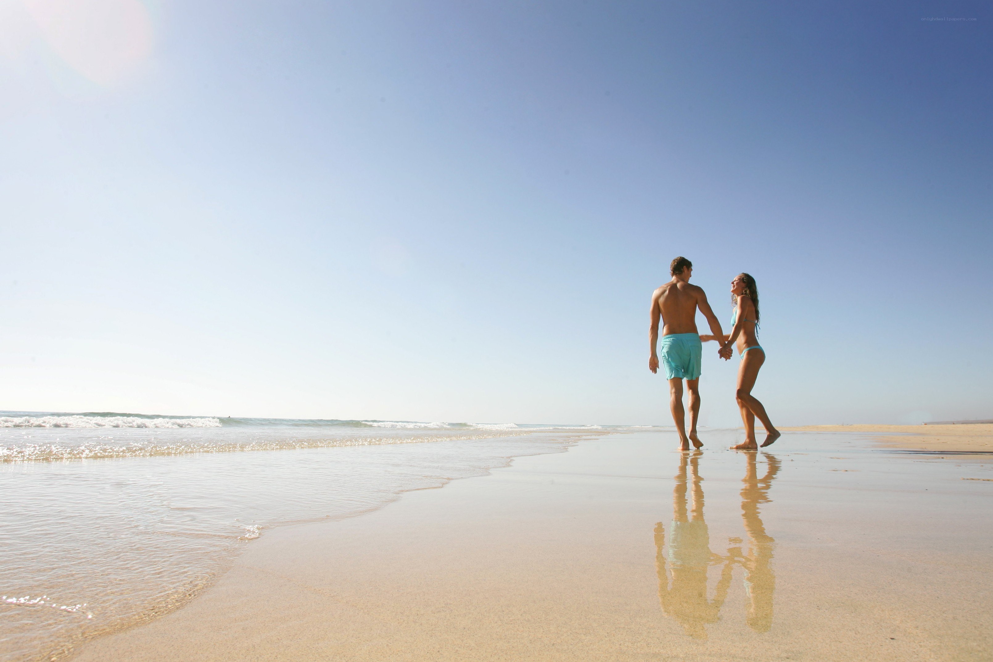 Couple walking on beach