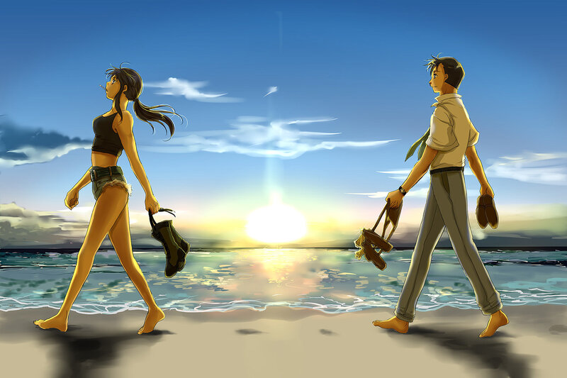 Couple walking on beach at sunset