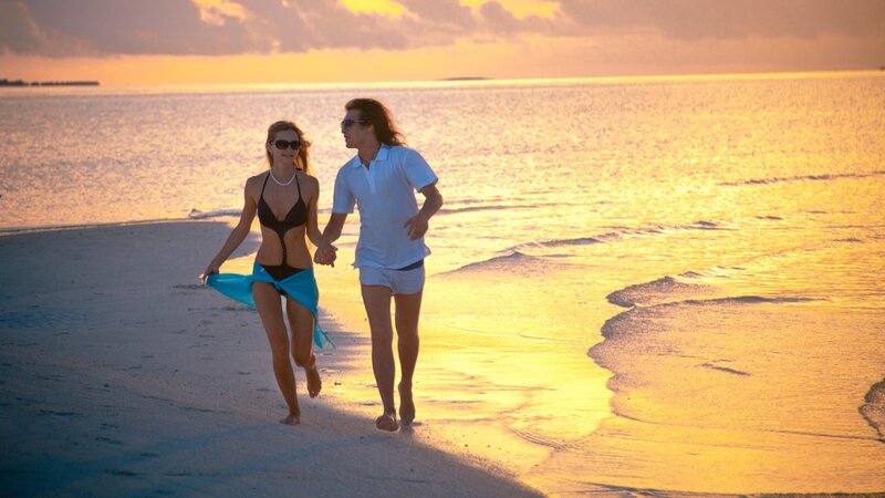 Couple Walking on Beach — Gold, Serene, Sunset, Photograph