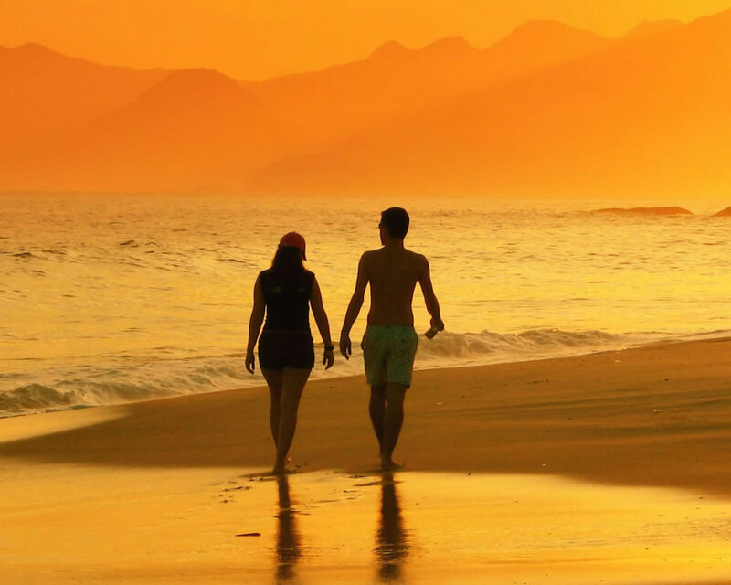 Couple Walking on Beach — Orange, Serene, Sunset, Photograph