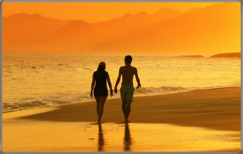 Couple Walking on Beach — Orange, Serene