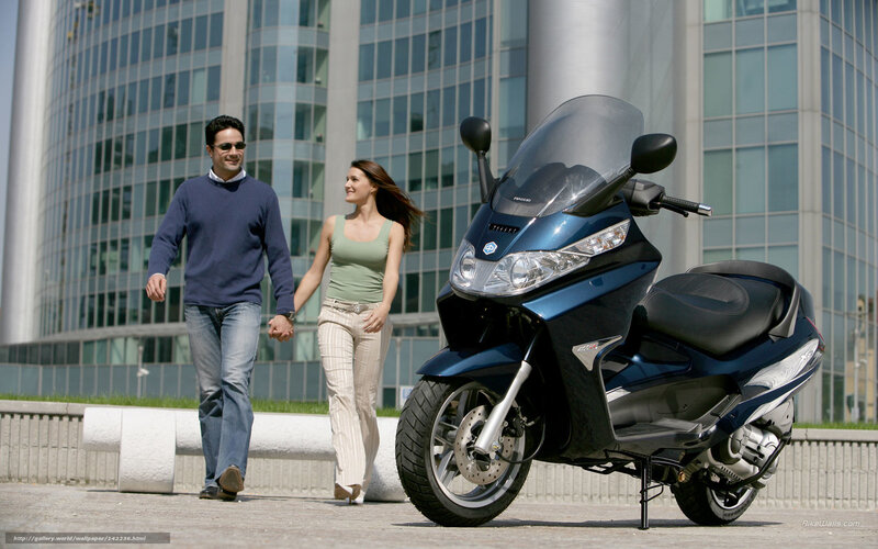 Couple Walking with Scooter