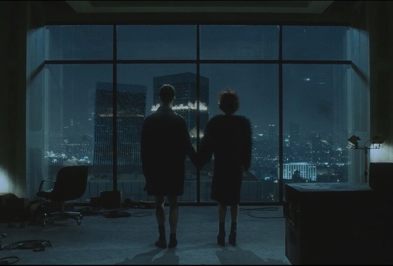Couple watches city at night