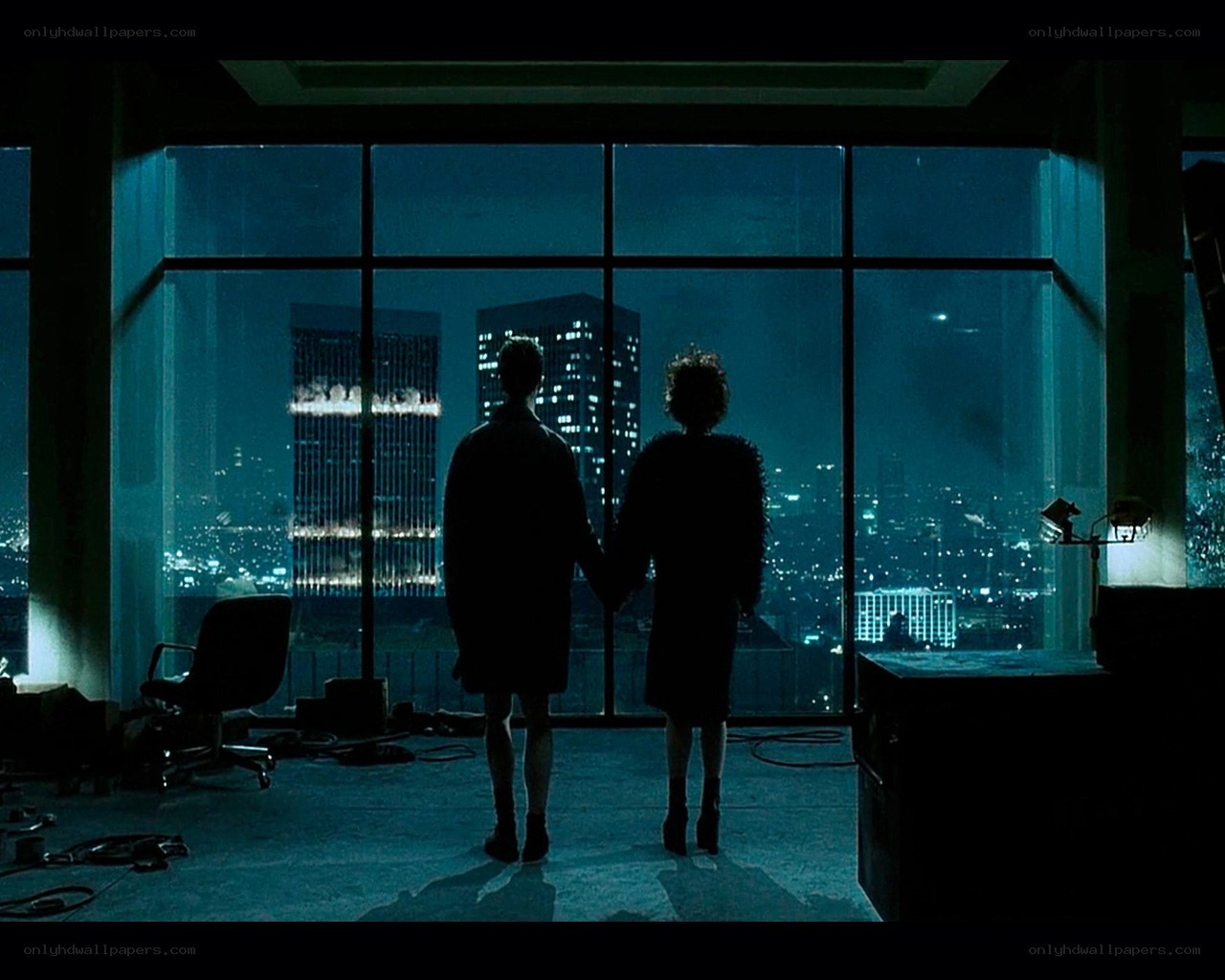 Couple watches city at night