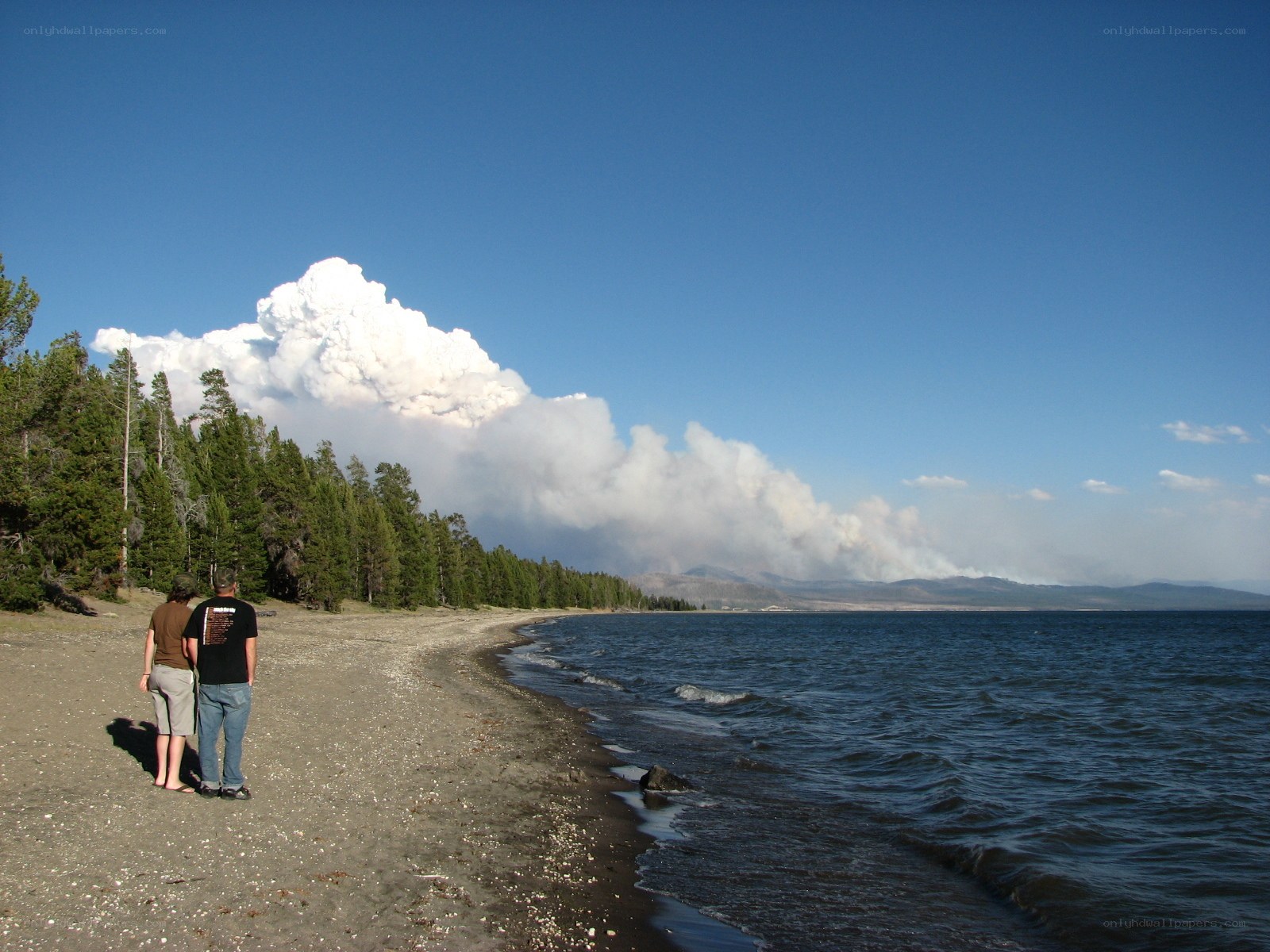 Couple watches wildfire smoke