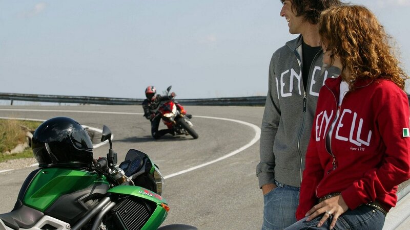 Couple watching motorcyclist on track