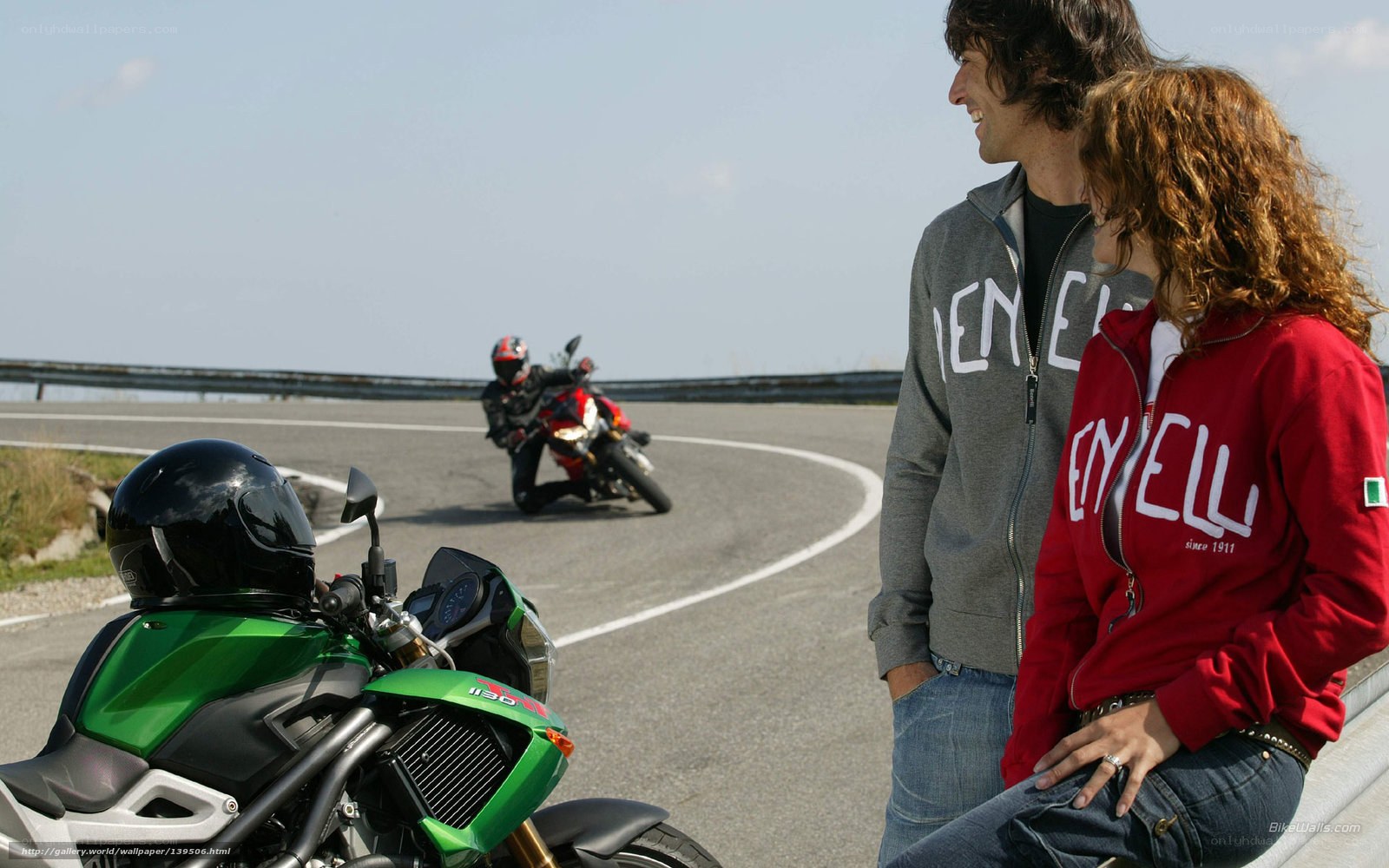 Couple watching motorcyclists