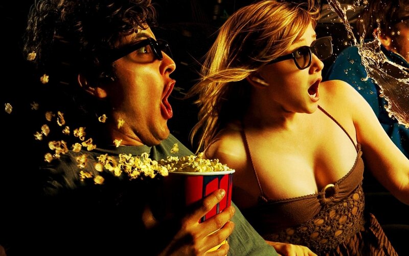 Couple watching movie in theater