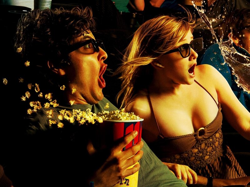 Couple watching movie in theater