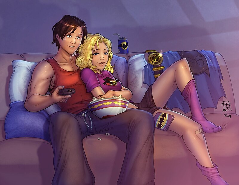 couple watching movie on couch
