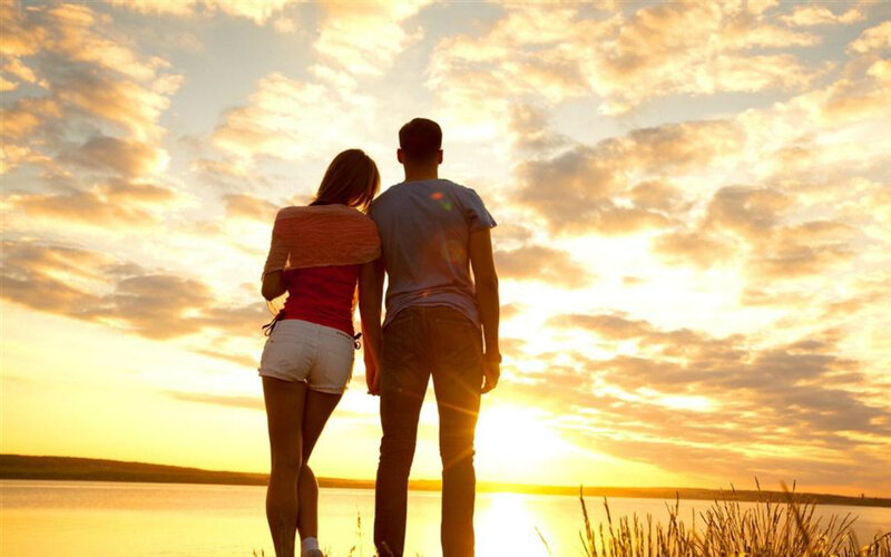 Couple Watching Sunset — Orange, Serene