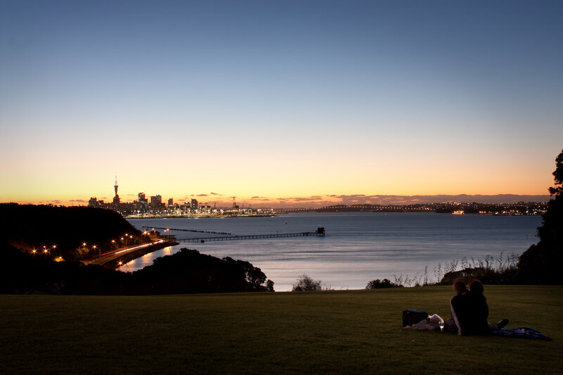 Couple watching sunset over city