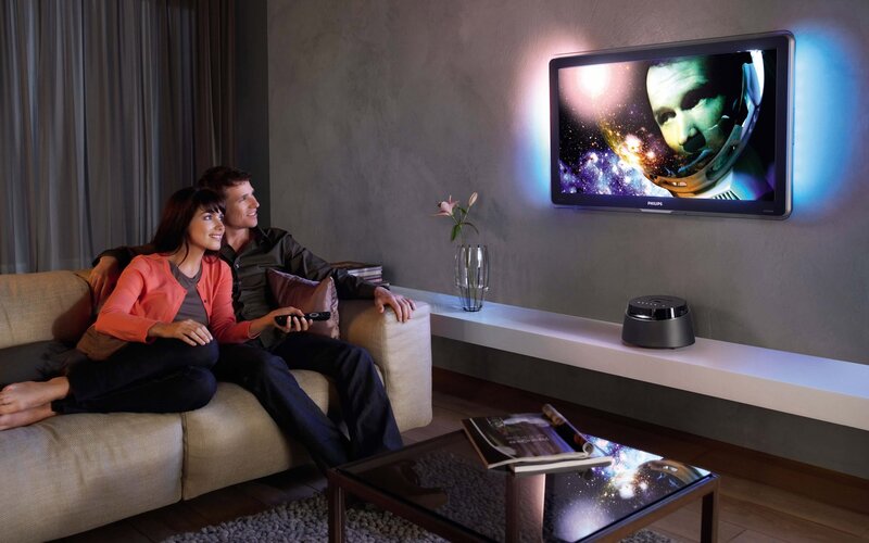 Couple watching TV at home