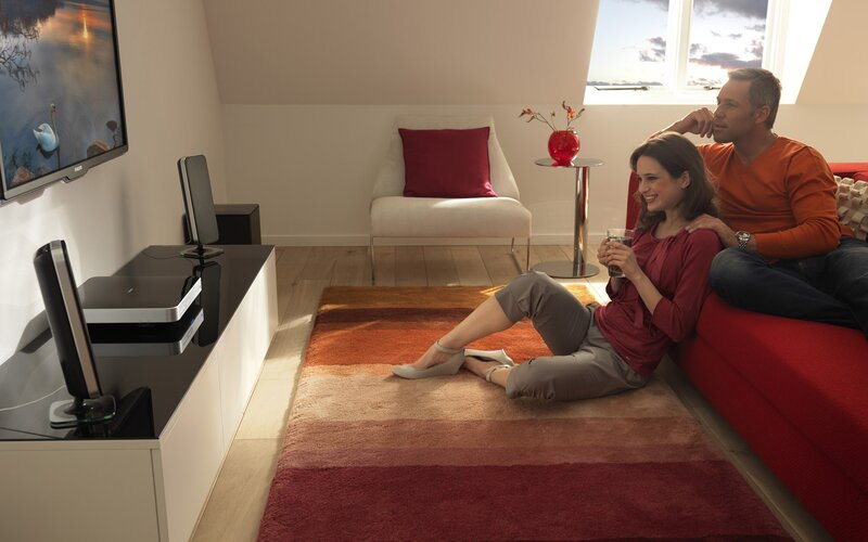 Couple watching TV at home