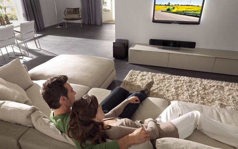 Couple watching TV at home