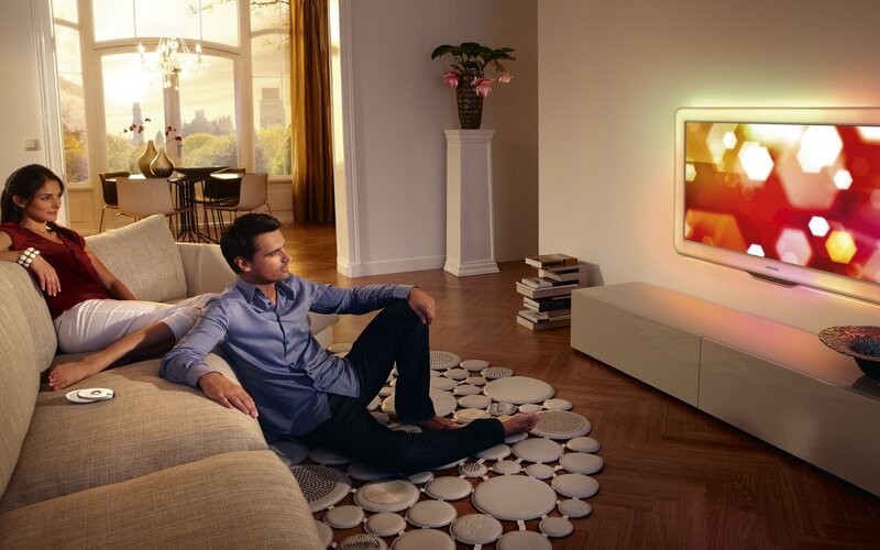 Couple watching TV at home
